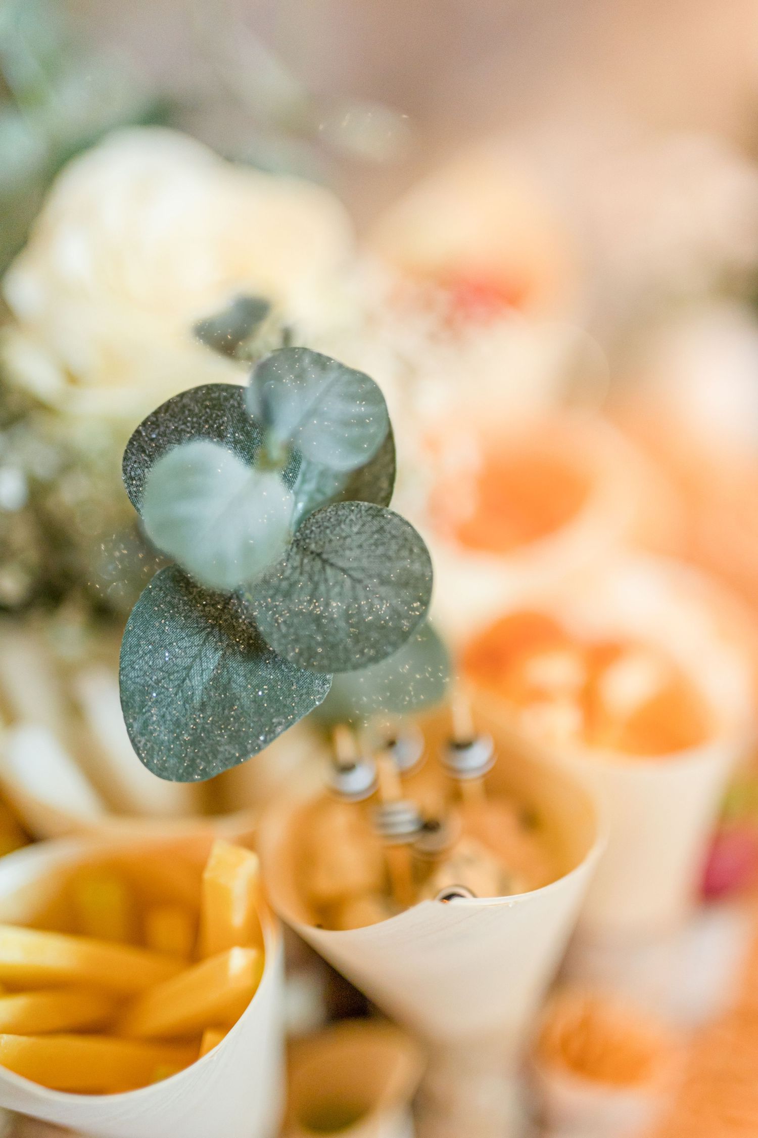 Elegant place settings with delicate garnishes and appetizers served in small bowls.