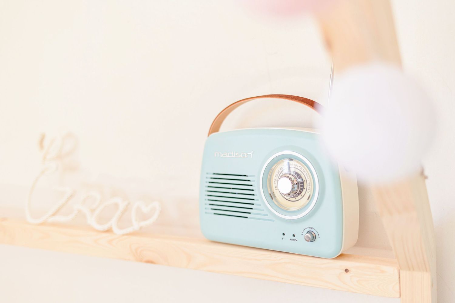 Vintage-style mint blue radio displayed against a clean white background.