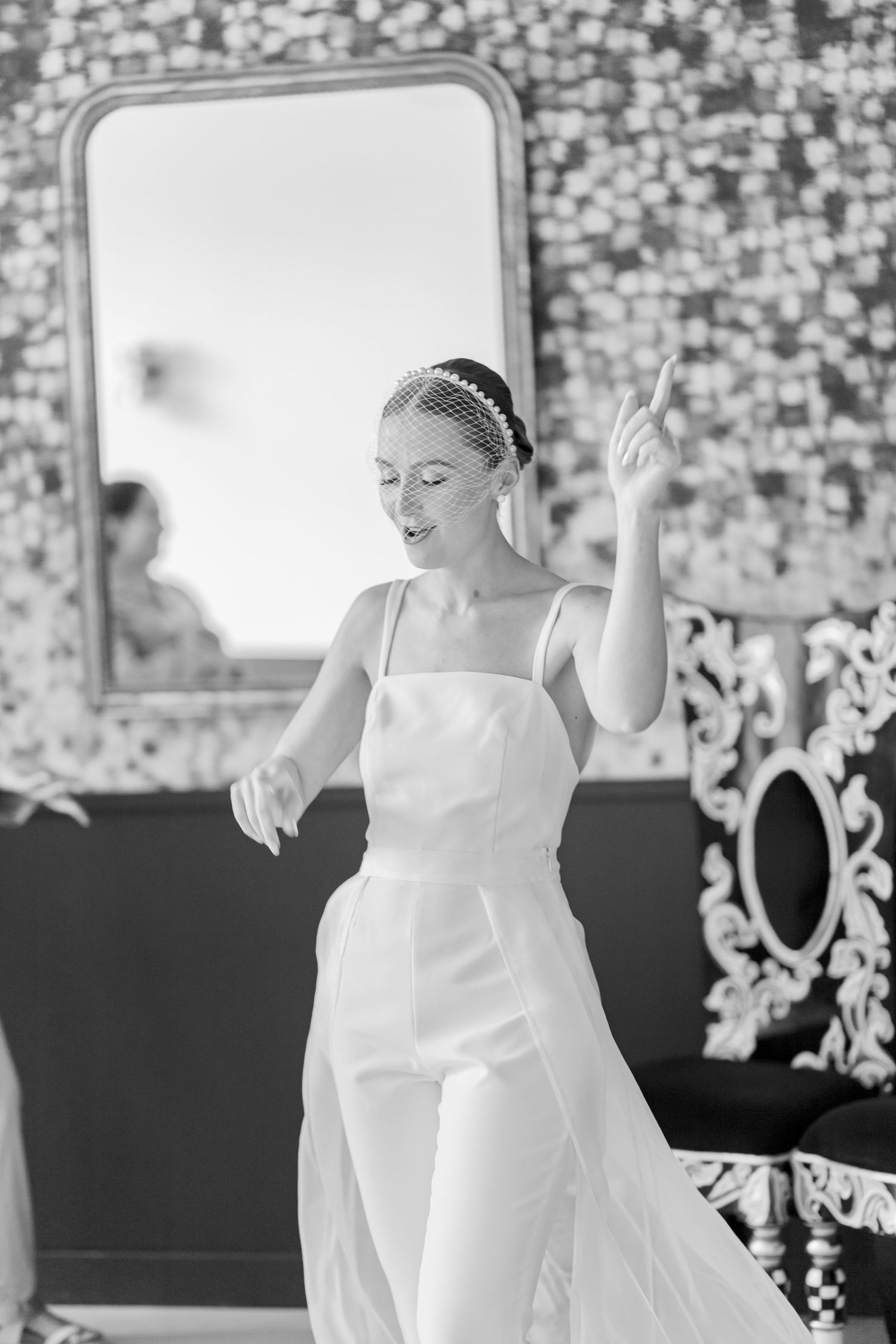A sequence showing joyful moments in a white dress against a patterned wallpaper background.
