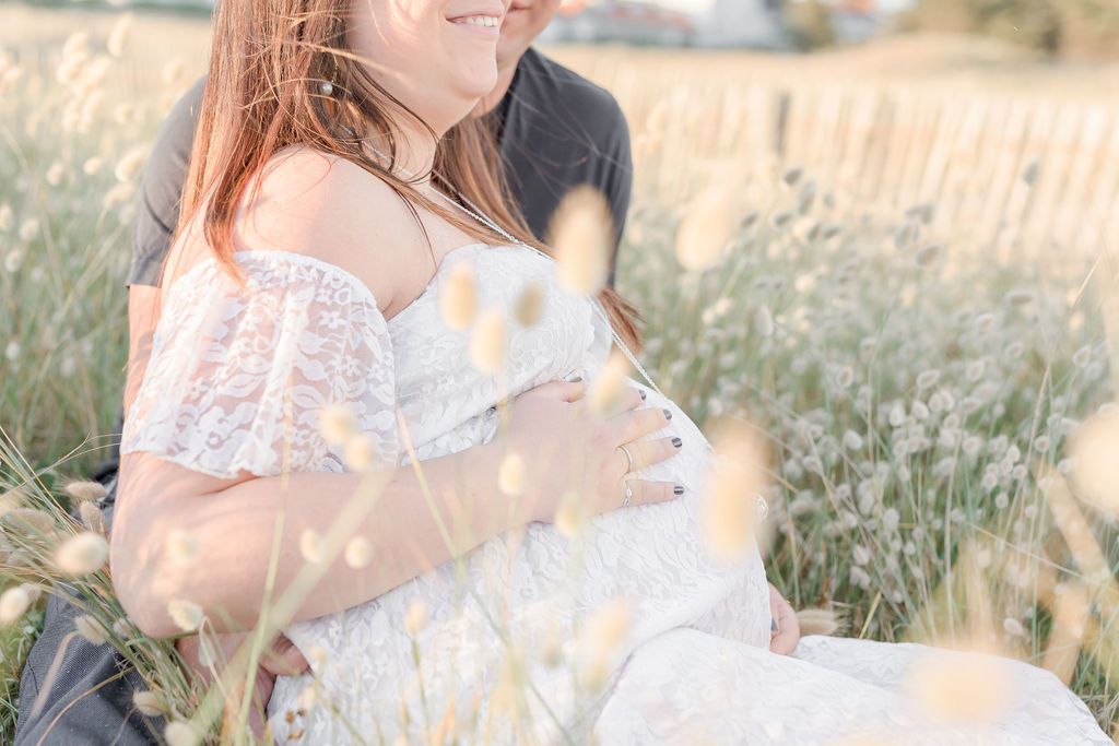 Soft sunlight illuminates a romantic scene in a meadow filled with delicate white blooms.