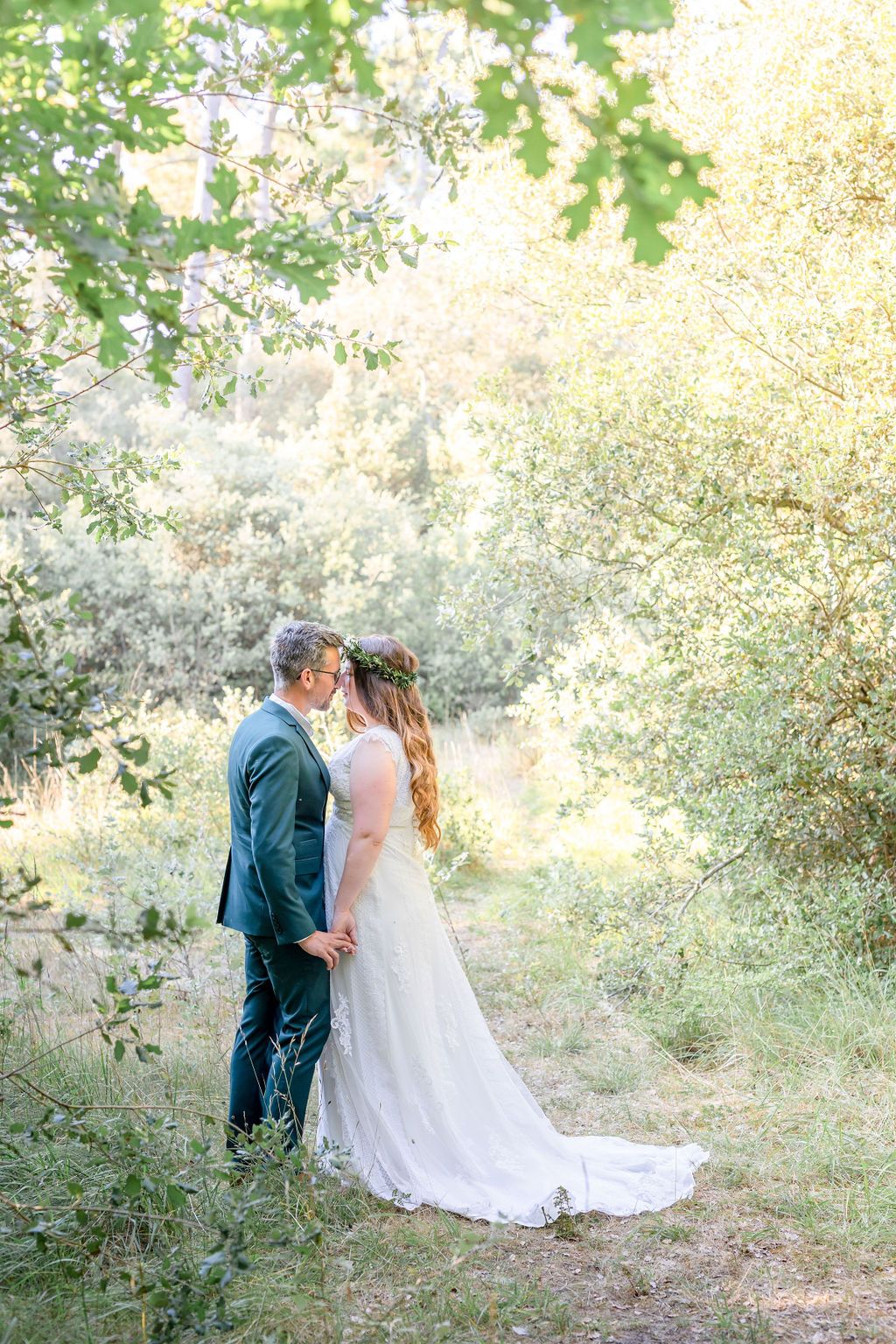 Romantic wedding photography sequence in a sun-dappled forest clearing.