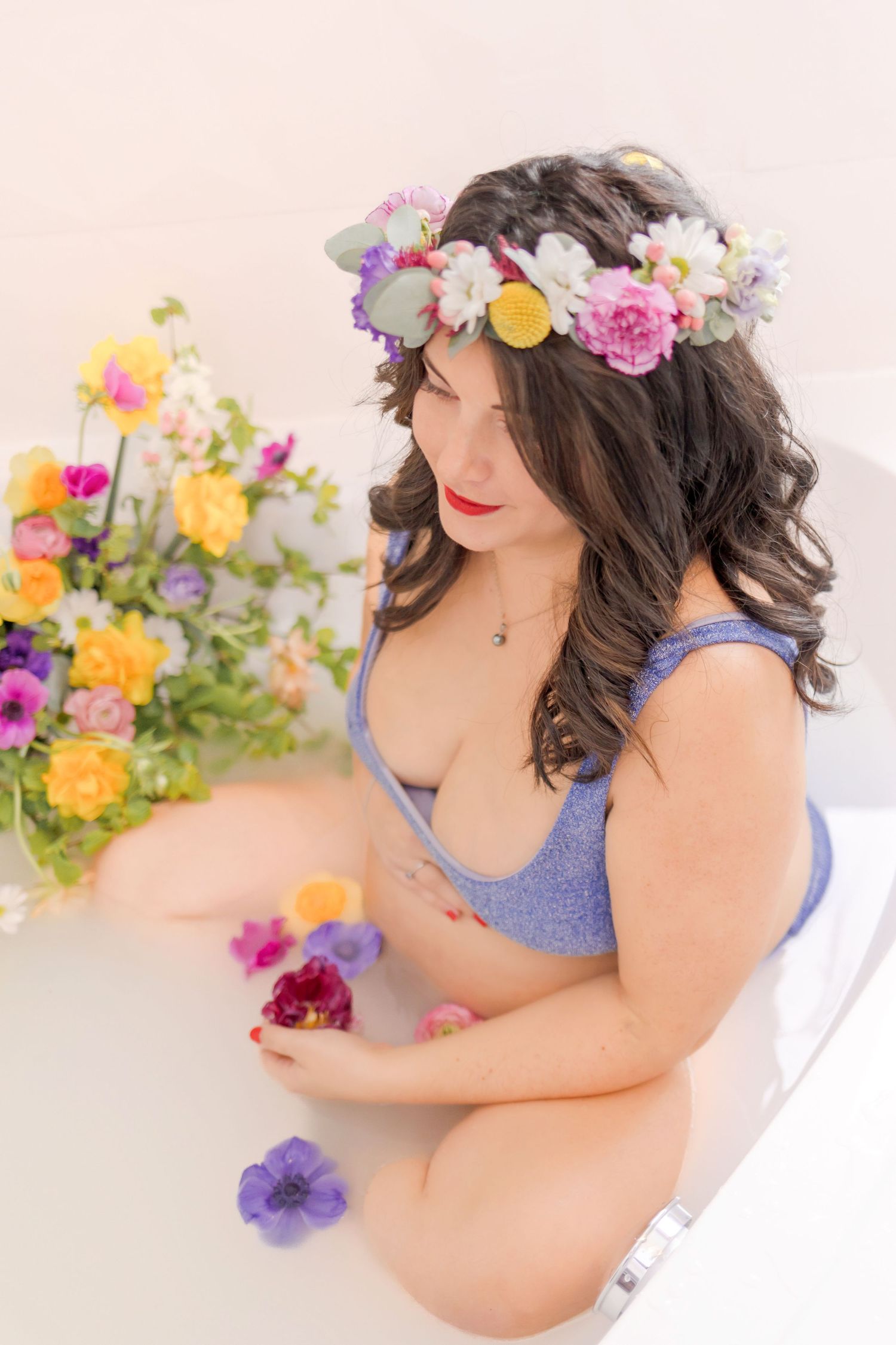 Romantic bath photography featuring flower crown and bright spring blooms.