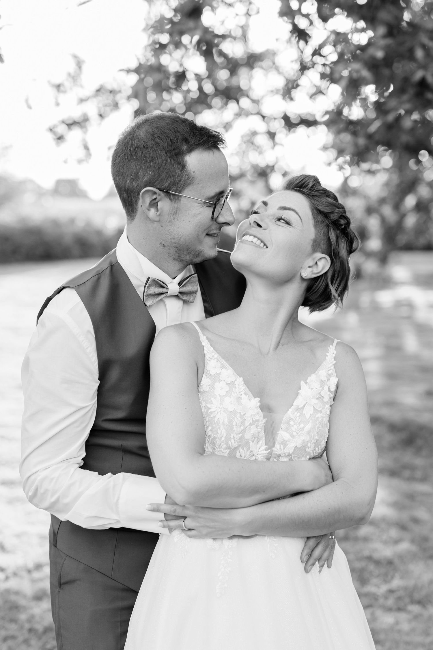 Black and white portrait of wedding couple sharing an intimate moment.