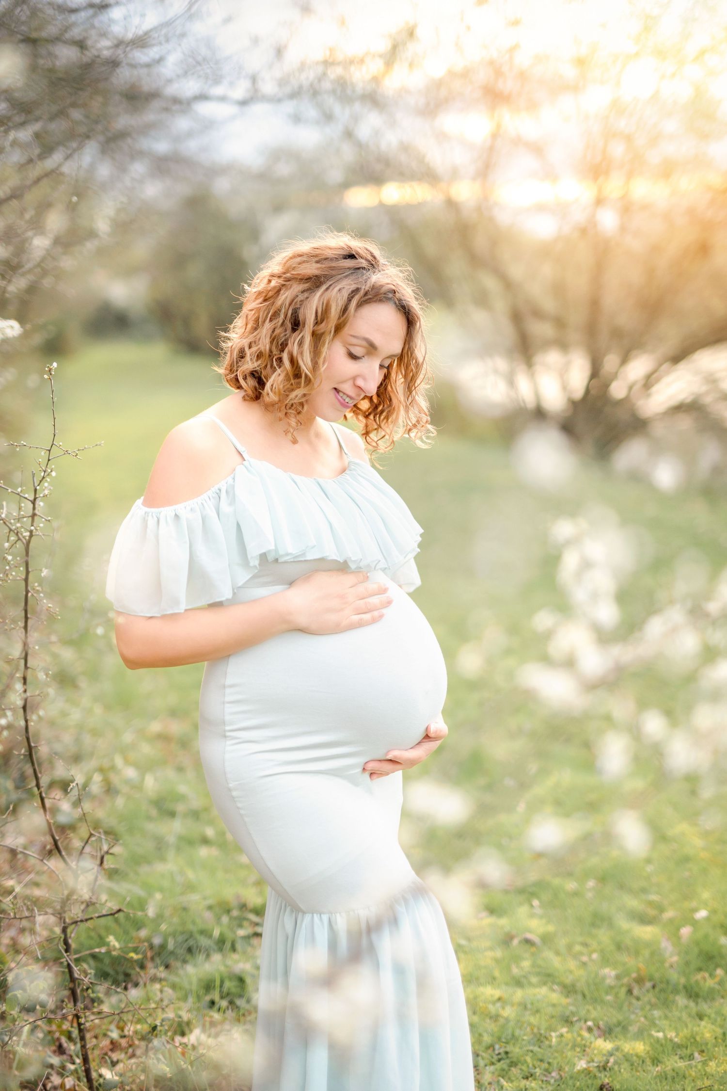 Soft and tender maternity moments captured in natural golden light.