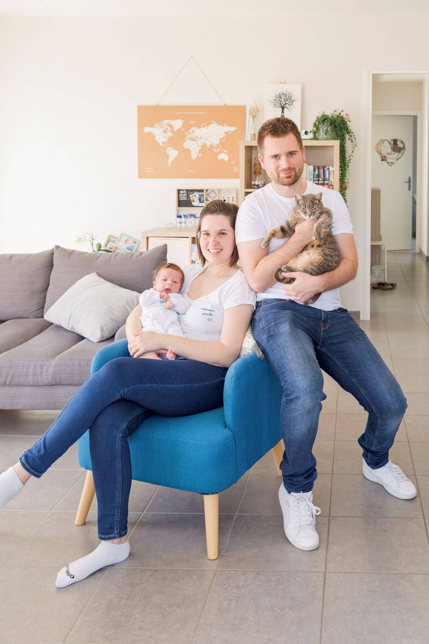 Family lifestyle photos showing playful interactions on a blue armchair.