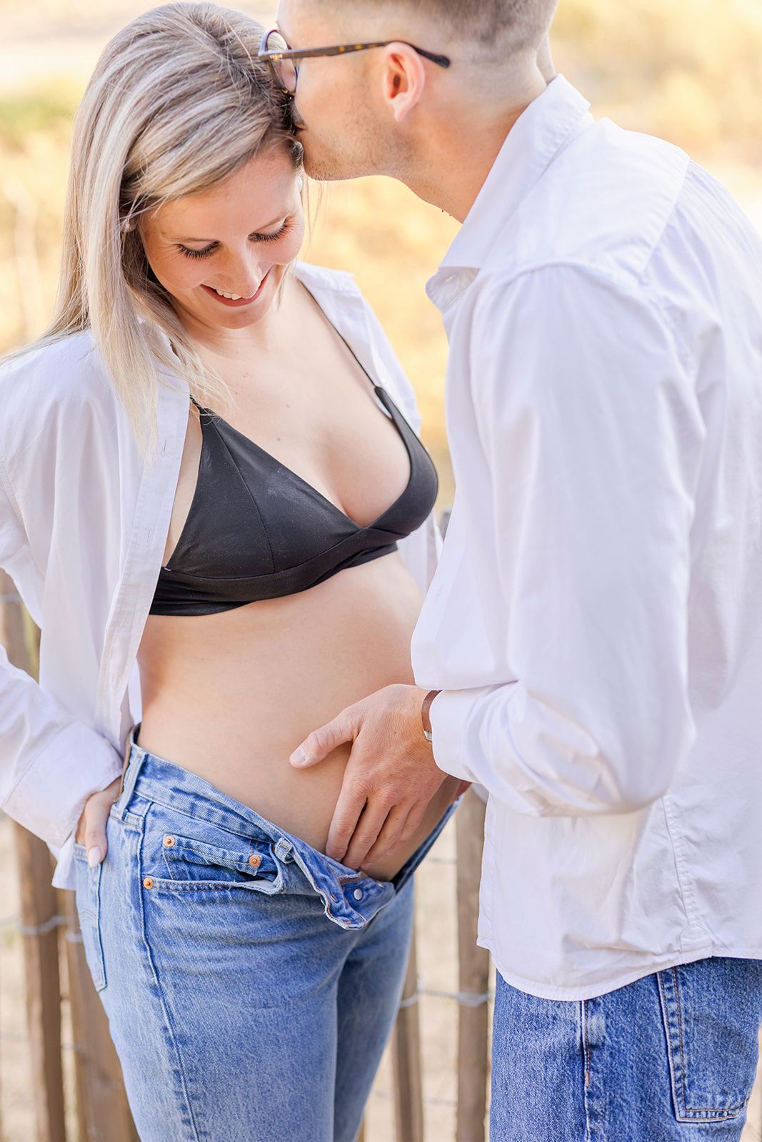 A collection of intimate couple photos showing tender moments in blue jeans and white shirts against a soft background.