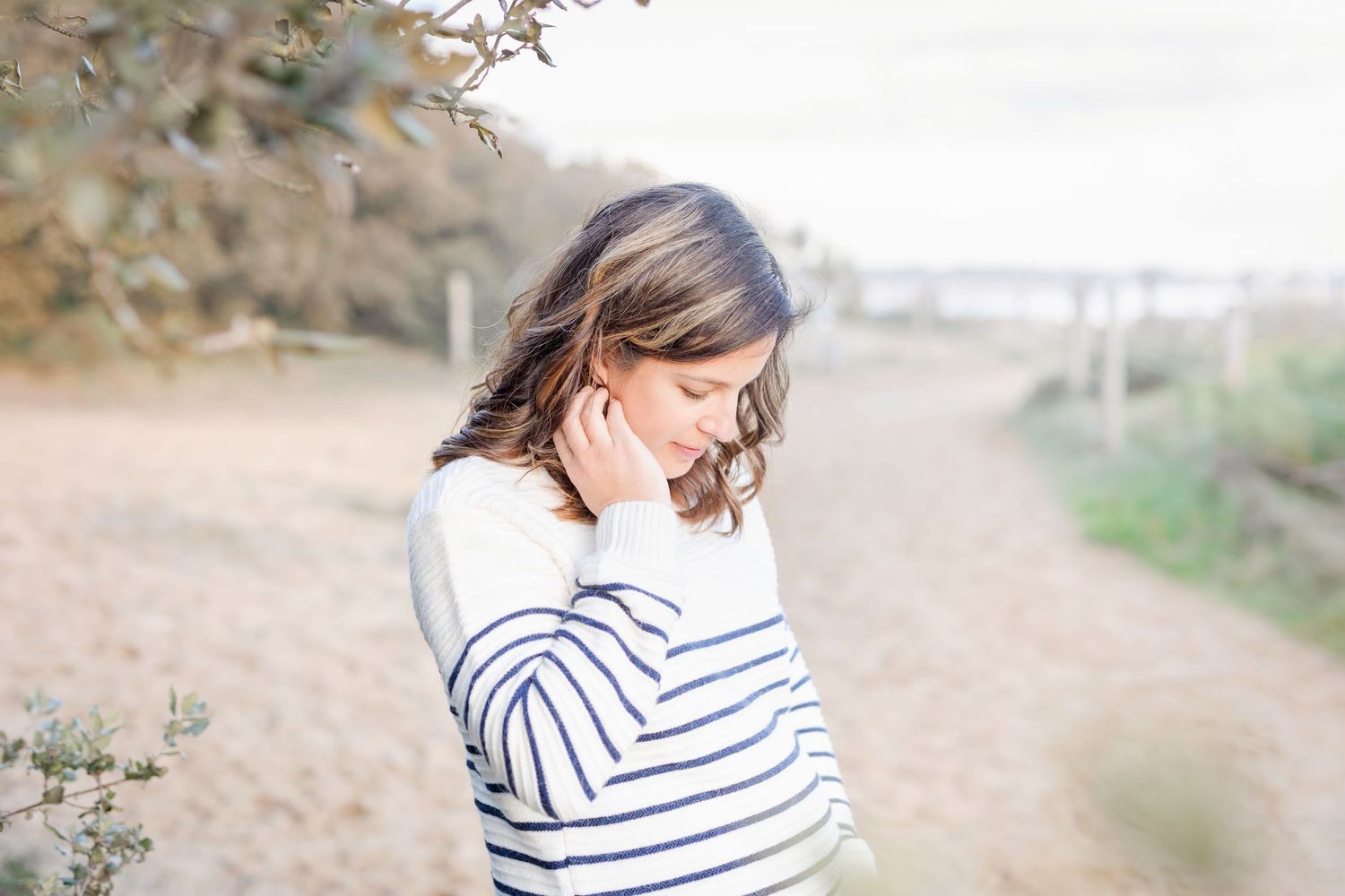 Series of outdoor lifestyle photos showing someone in a striped sweater in natural lighting.