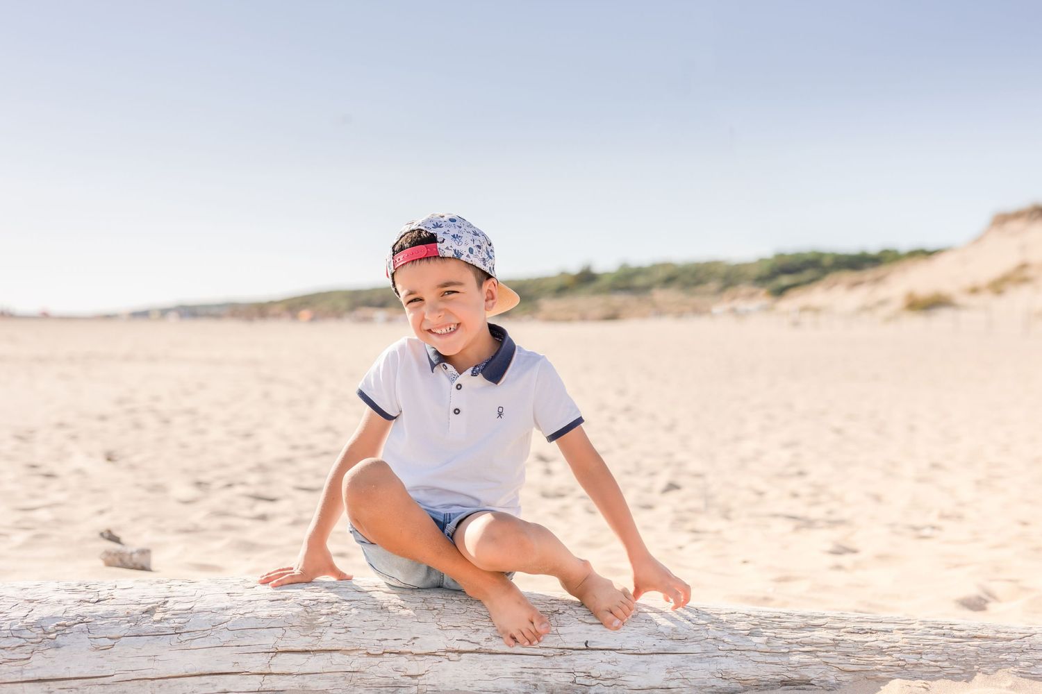 Playful beach photography capturing joyful family interactions.