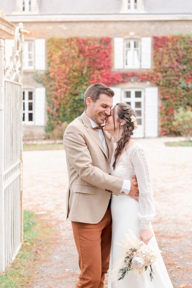 Intimate wedding portraits taken against the backdrop of a historic French manor house.
