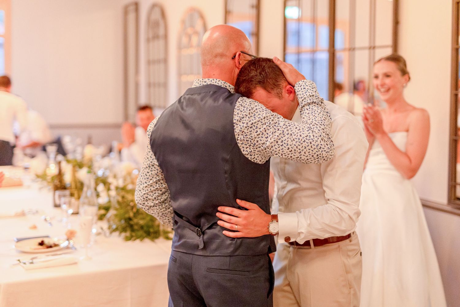 Couples dancing together during a romantic reception moment.