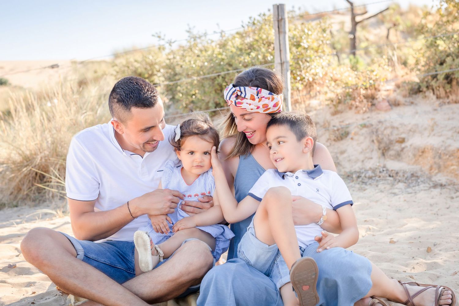 Natural family interactions captured during beach photography session.
