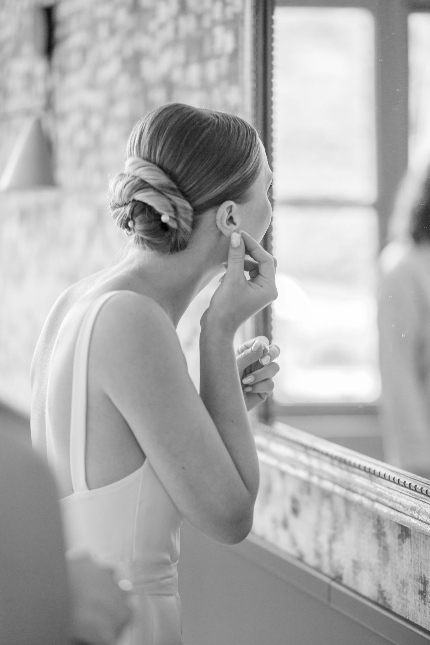 Wedding preparations showing formal attire details in black and white photography.