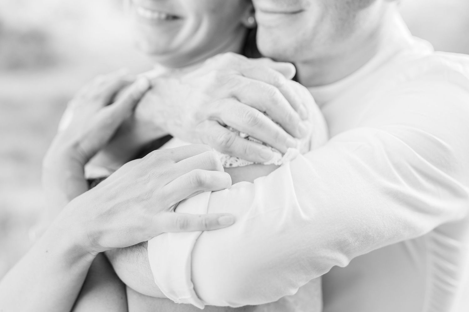 Intimate black and white close-ups showing tender family affection.
