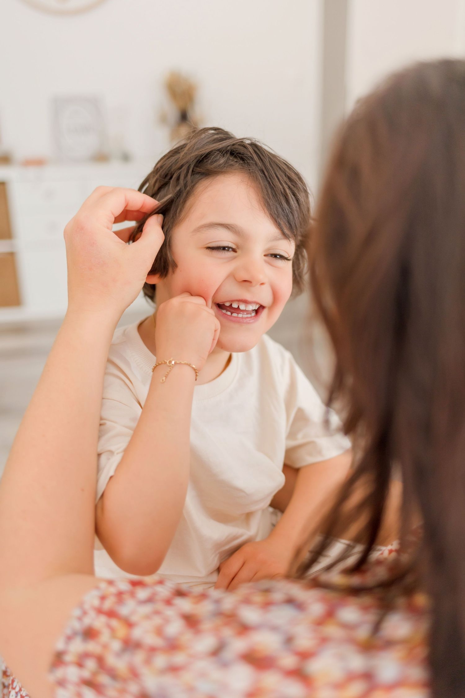 Laughter and joy fill the frame during an intimate indoor play session.
