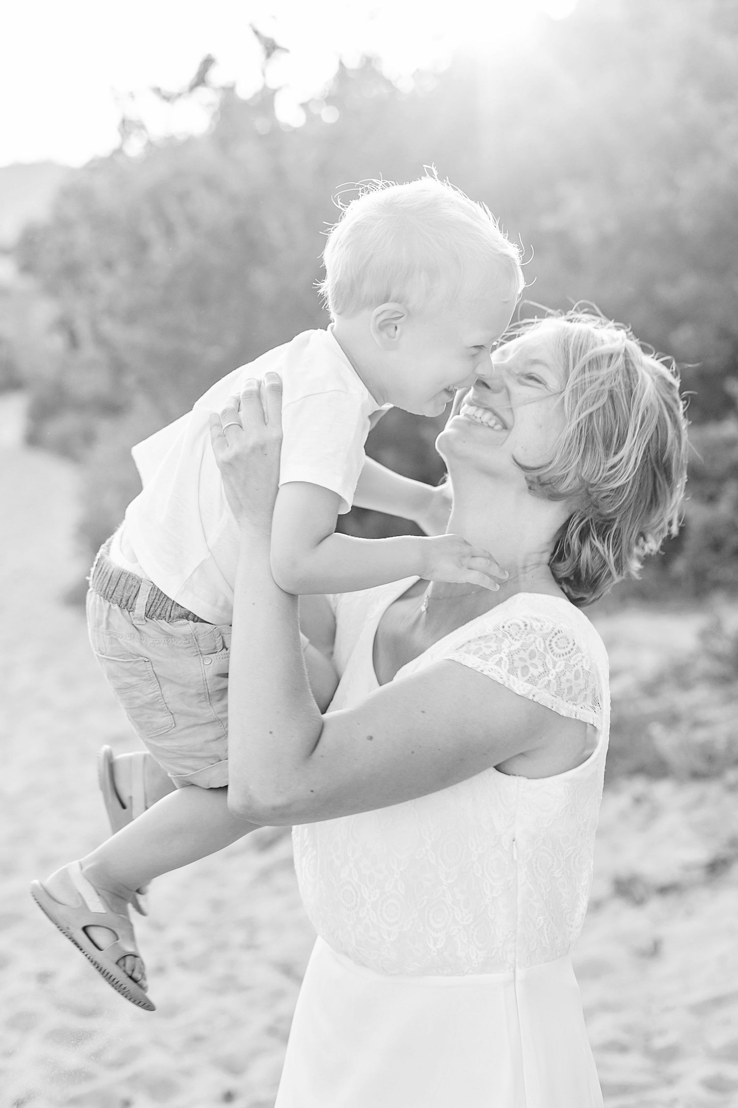 Black and white series of joyful family moments on a sunny afternoon.
