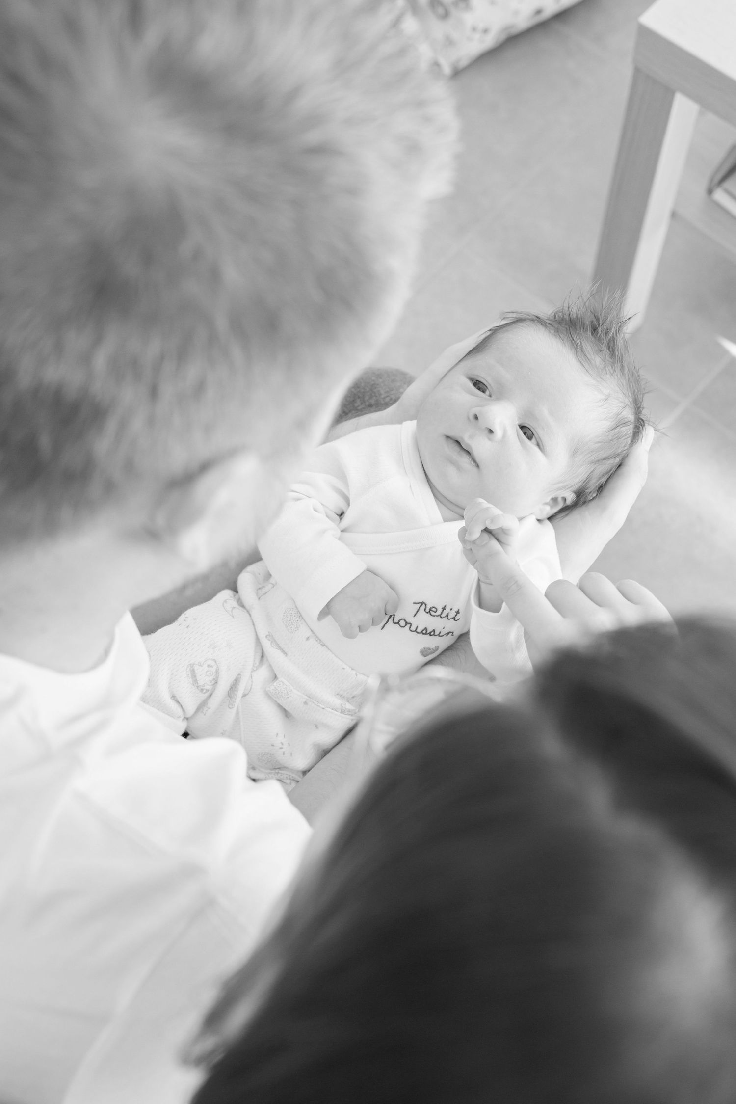 Black and white close-up photo of infant sleeping peacefully.