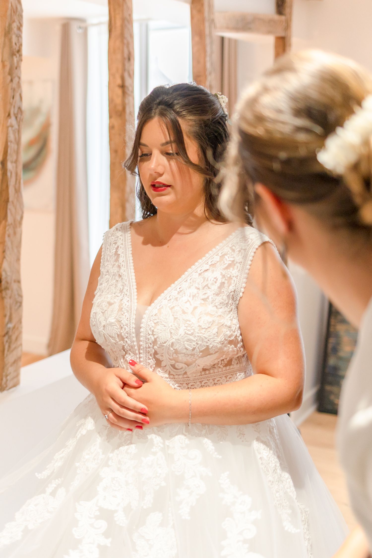 Joyful moments captured during a wedding dress fitting appointment.