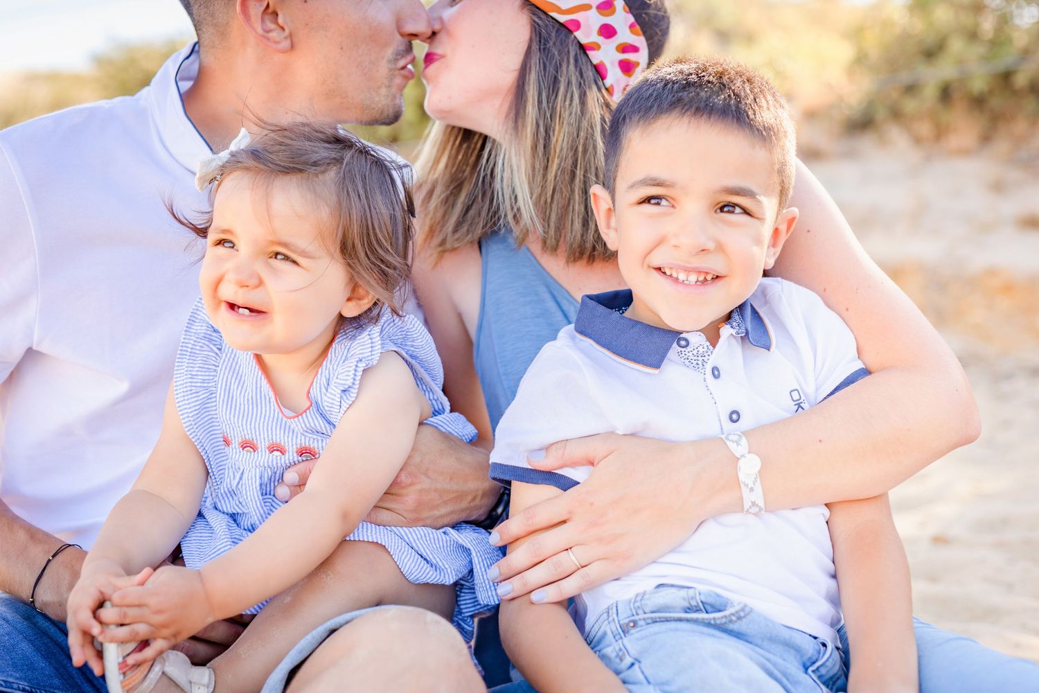 Candid moments of family bonding during sunset beach session.