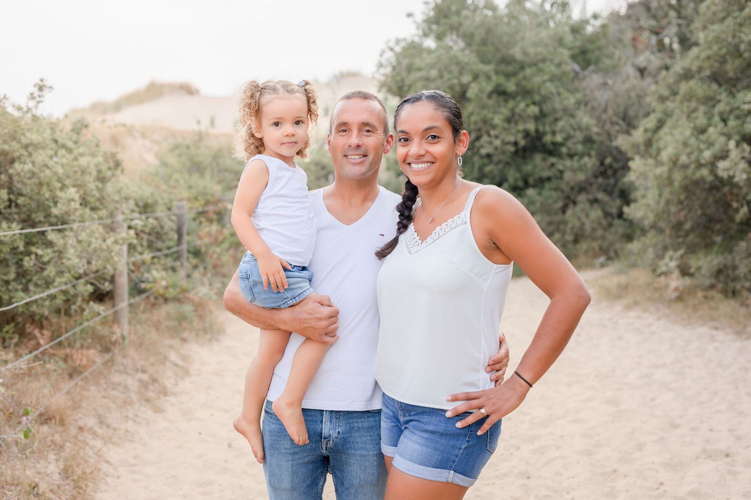 Candid couple photos showing natural laughter and embraces on desert walking trail.