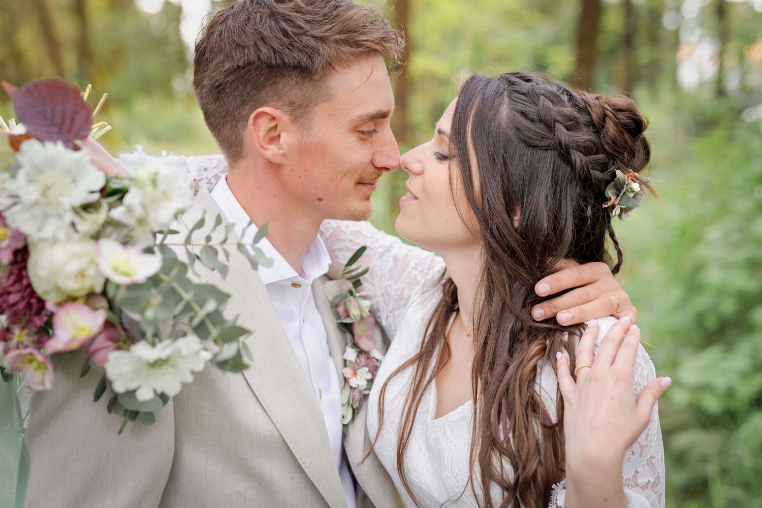 Romantic wedding photography sequence showing intimate moments between newlyweds in forest lighting.
