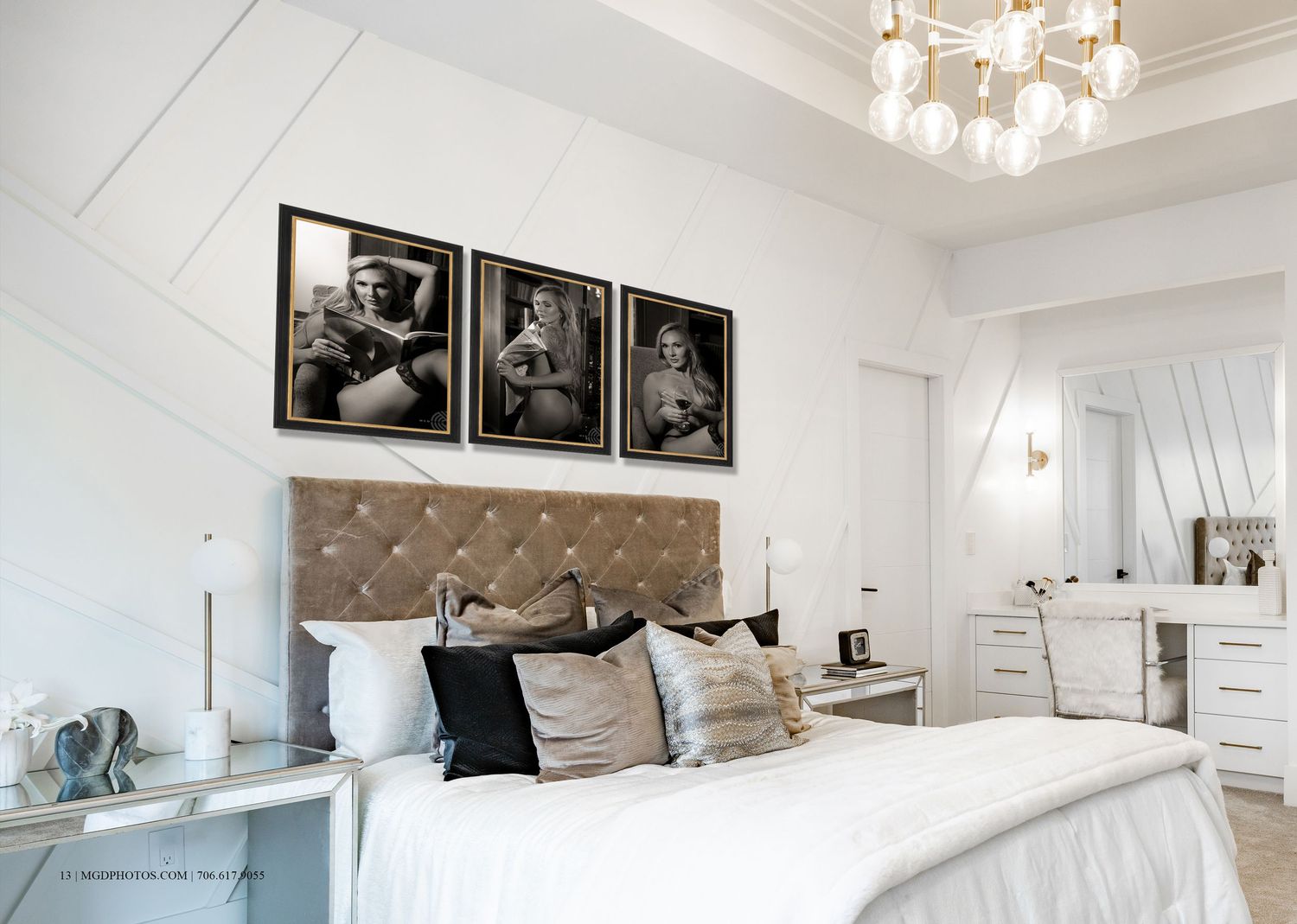 Elegant white bedroom with tufted headboard, gold chandelier, and three black-and-white framed photos above the bed.