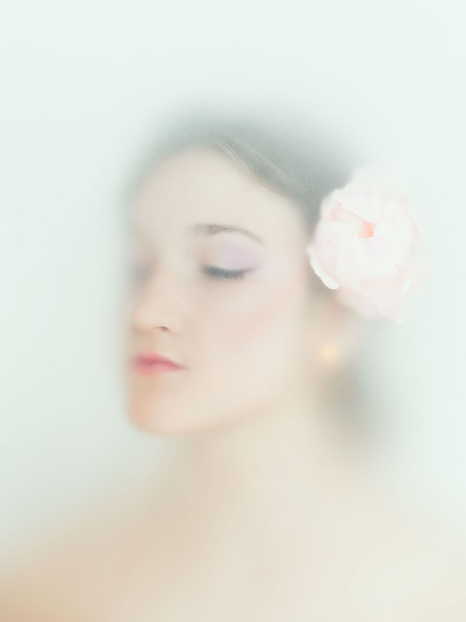 Soft focus beauty portrait series with delicate pink tones and dreamy ethereal lighting effects.