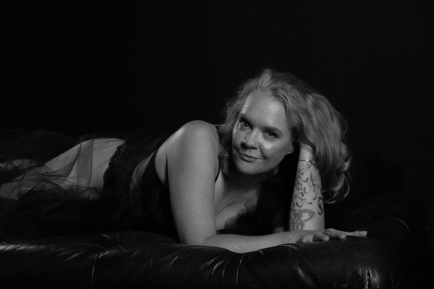A black and white photo sequence showing a person reclining on a couch in different poses.