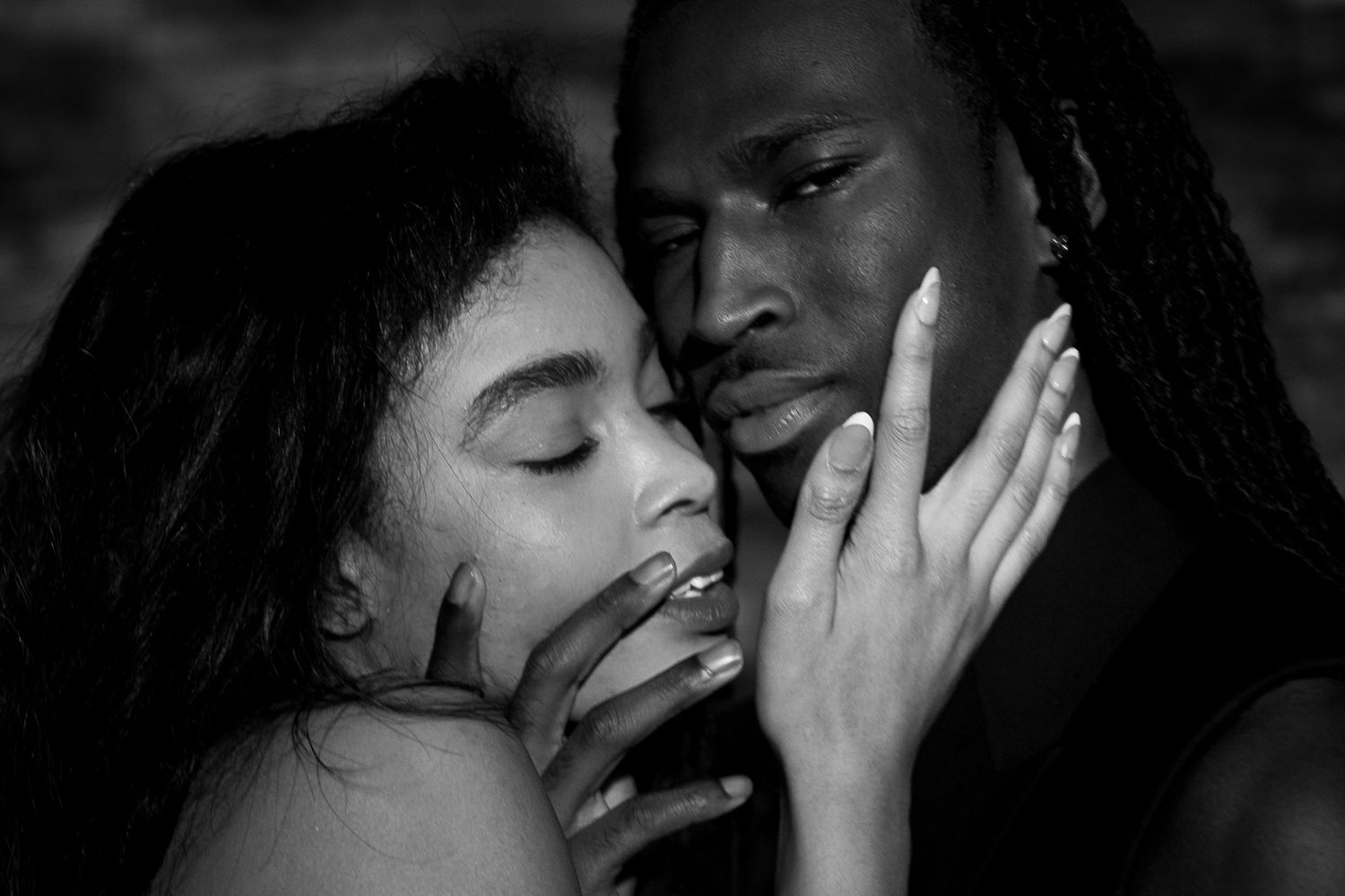 A series of black and white romantic photos showing couples sharing intimate kisses and tender moments.