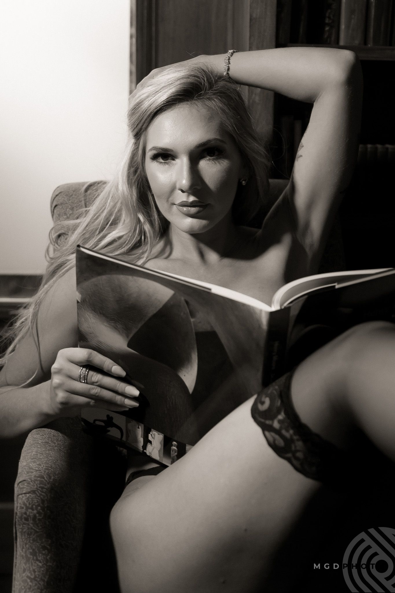 Artistic black and white portrait series with dramatic shadows and intimate mood.