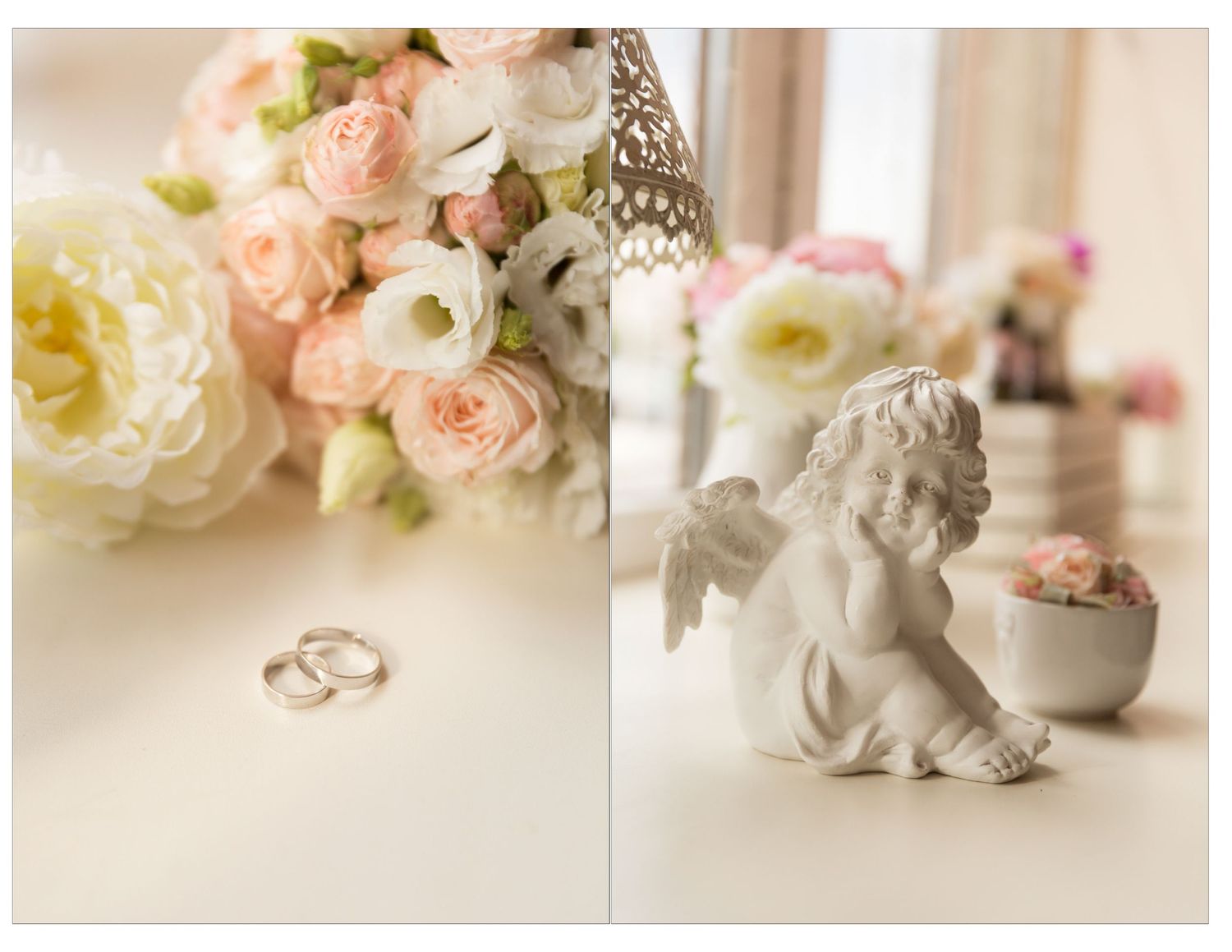 Wedding rings and angel figurine beside a romantic bouquet of pink and white roses on a white surface.