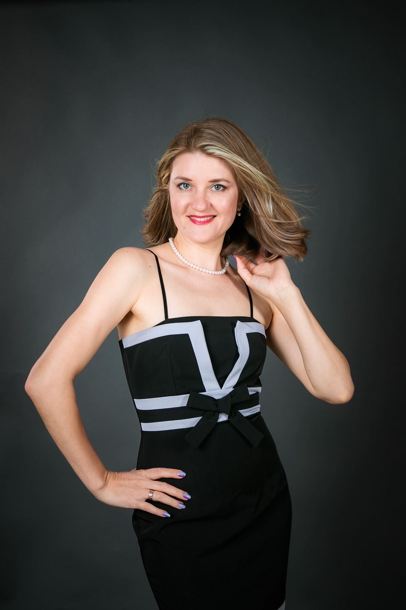 Studio portrait series in black and white formal wear against dark background.