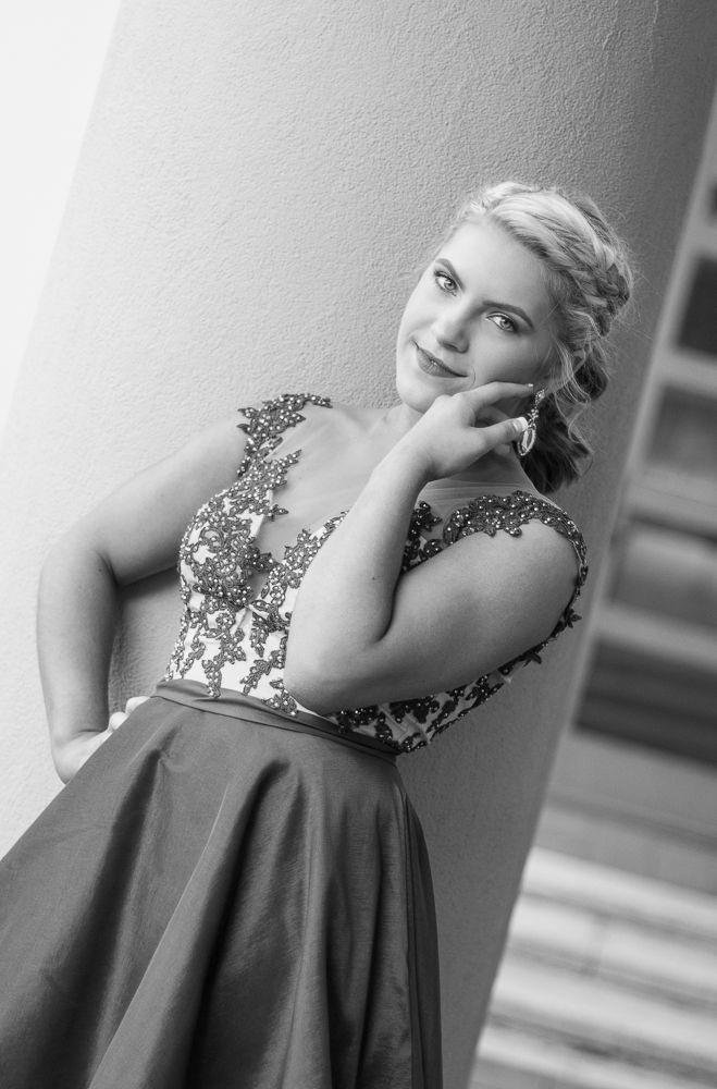 Black and white portrait series featuring an embellished formal dress and artistic poses.