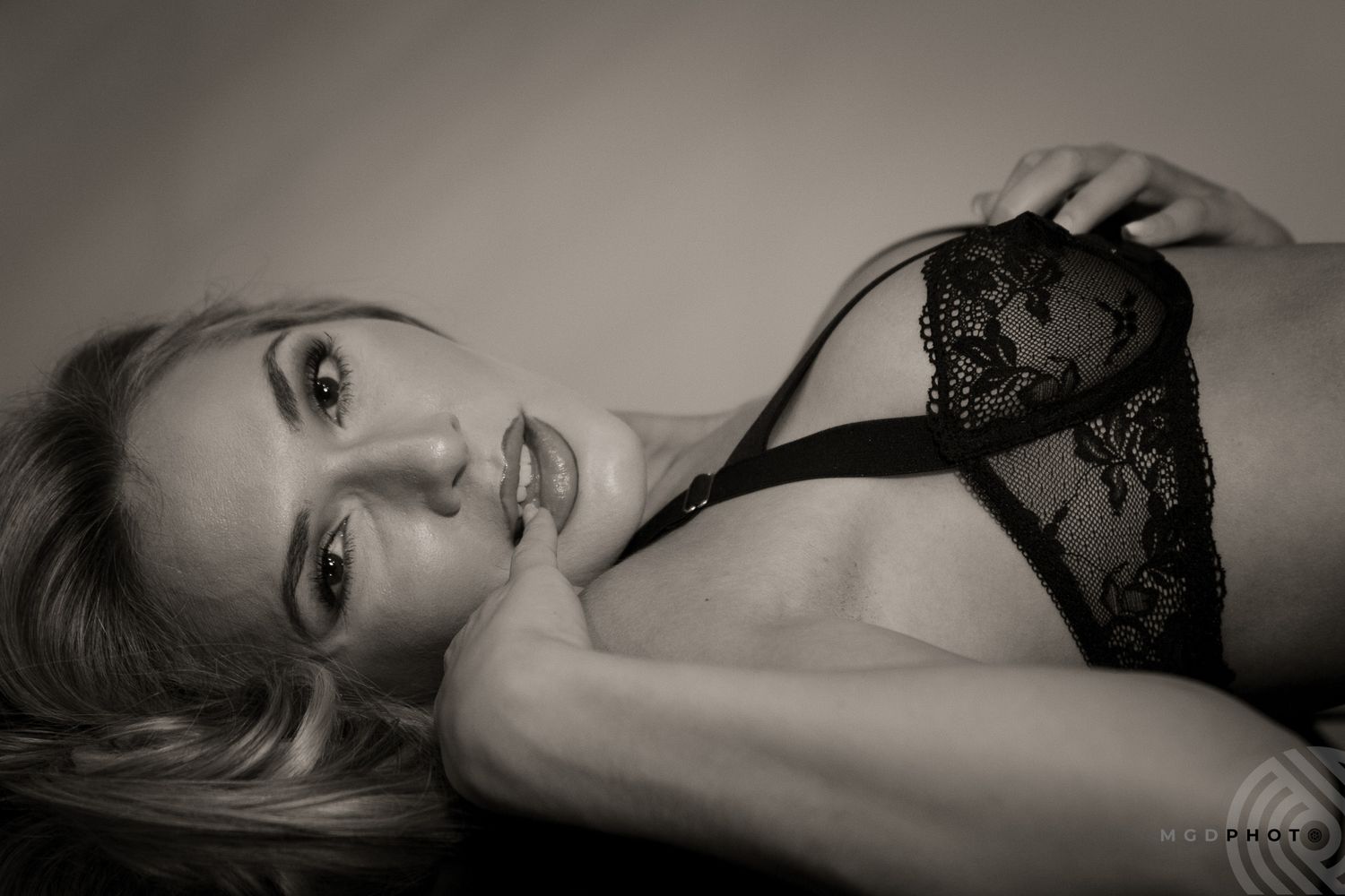 Artistic black and white boudoir series with dramatic lighting and composition.
