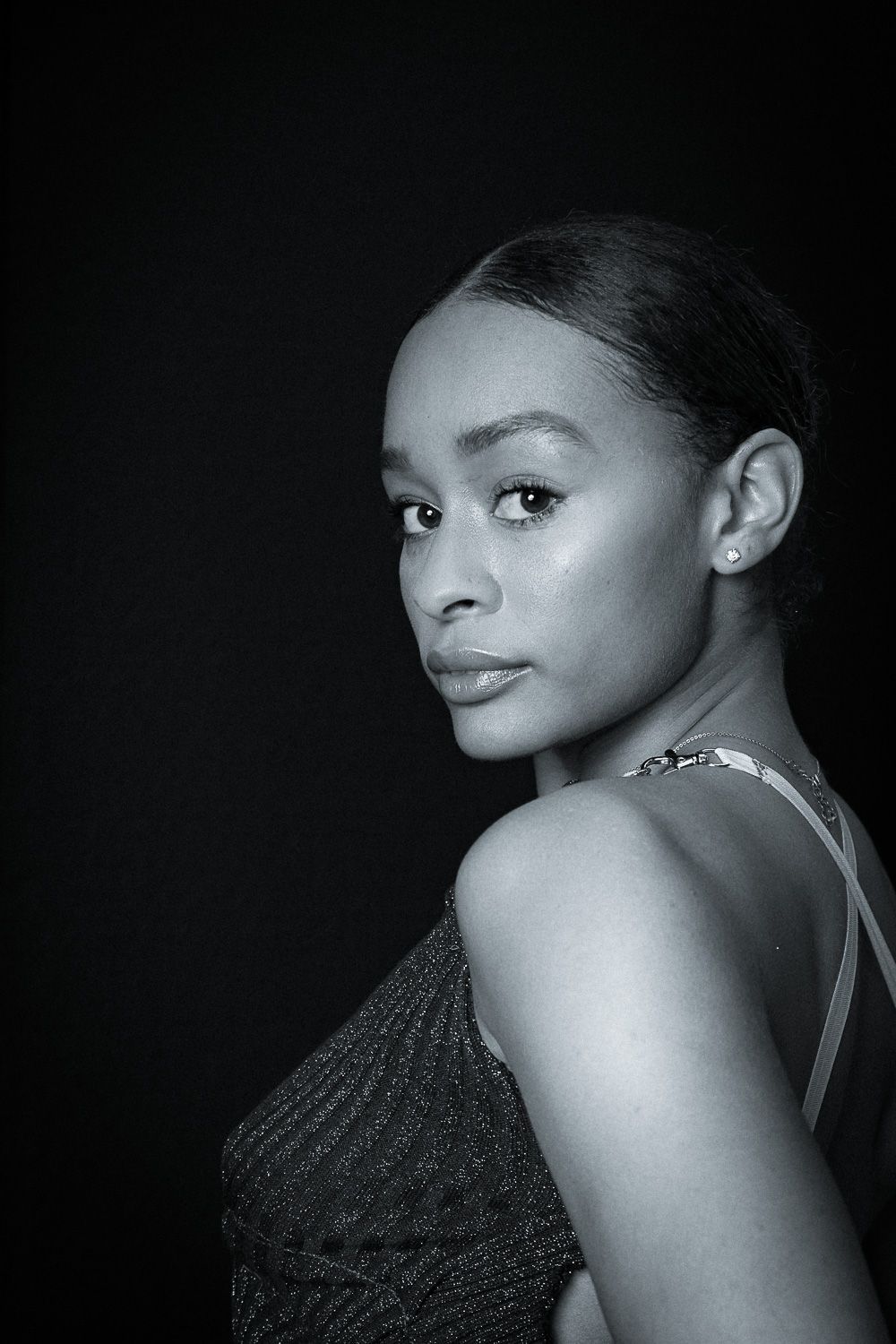 Artistic black and white headshots showing elegant poses and dramatic shadows.