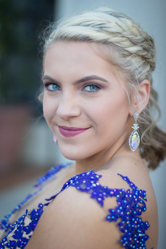 Portrait series showcasing intricate blue beadwork detail on formal dress with braided hairstyle.
