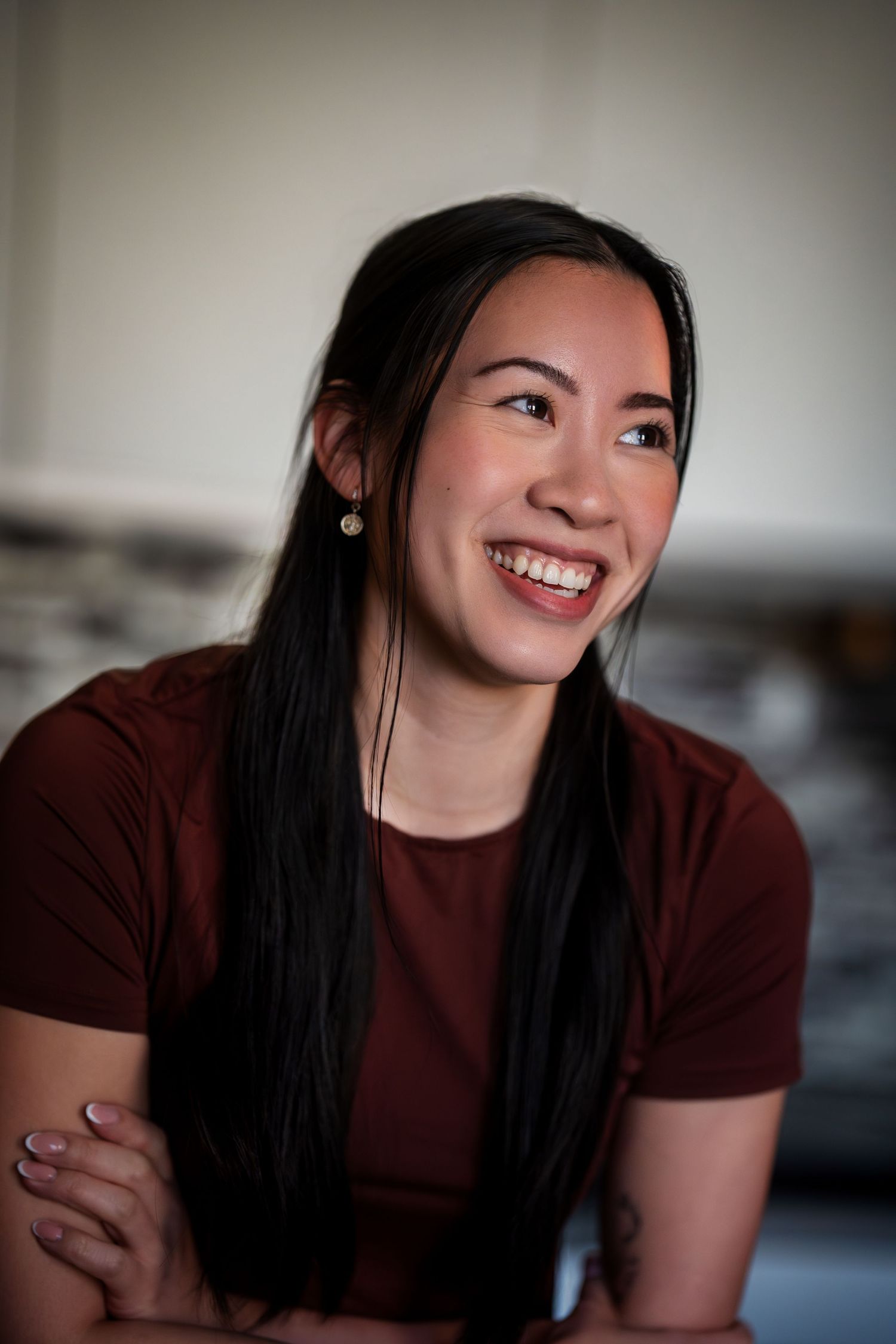 A casual portrait in natural lighting shows warmth and genuine expression.