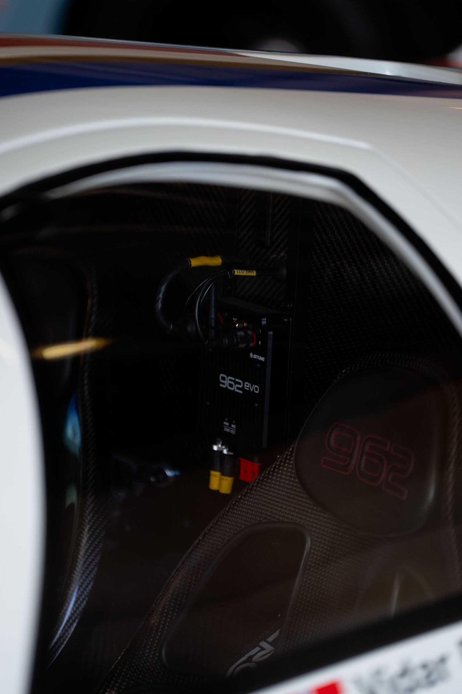 Dark tinted car windows with reflective surfaces showing faint interior details in low light conditions.