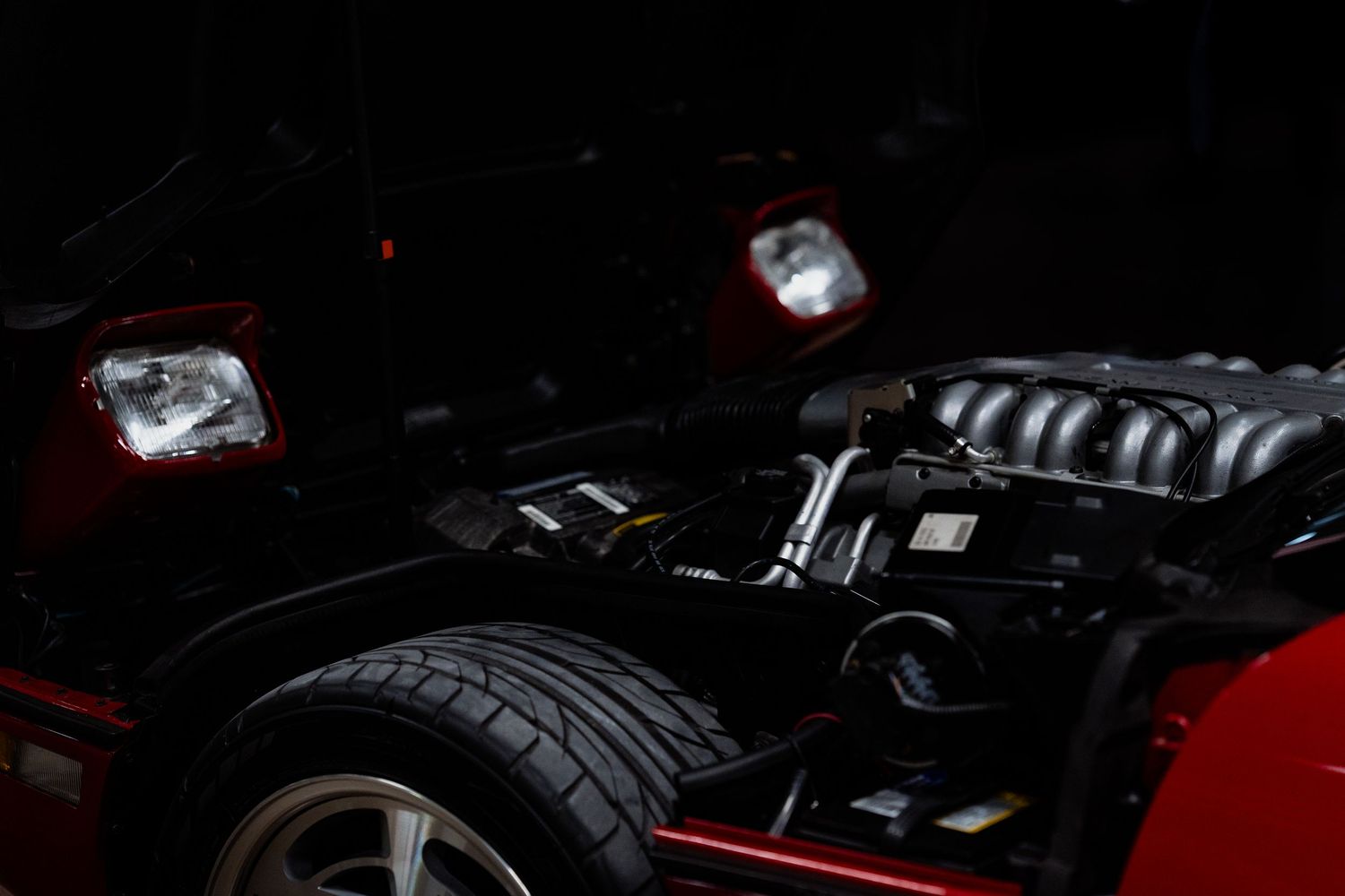 Detailed view of a high-performance car engine with chrome and black components.