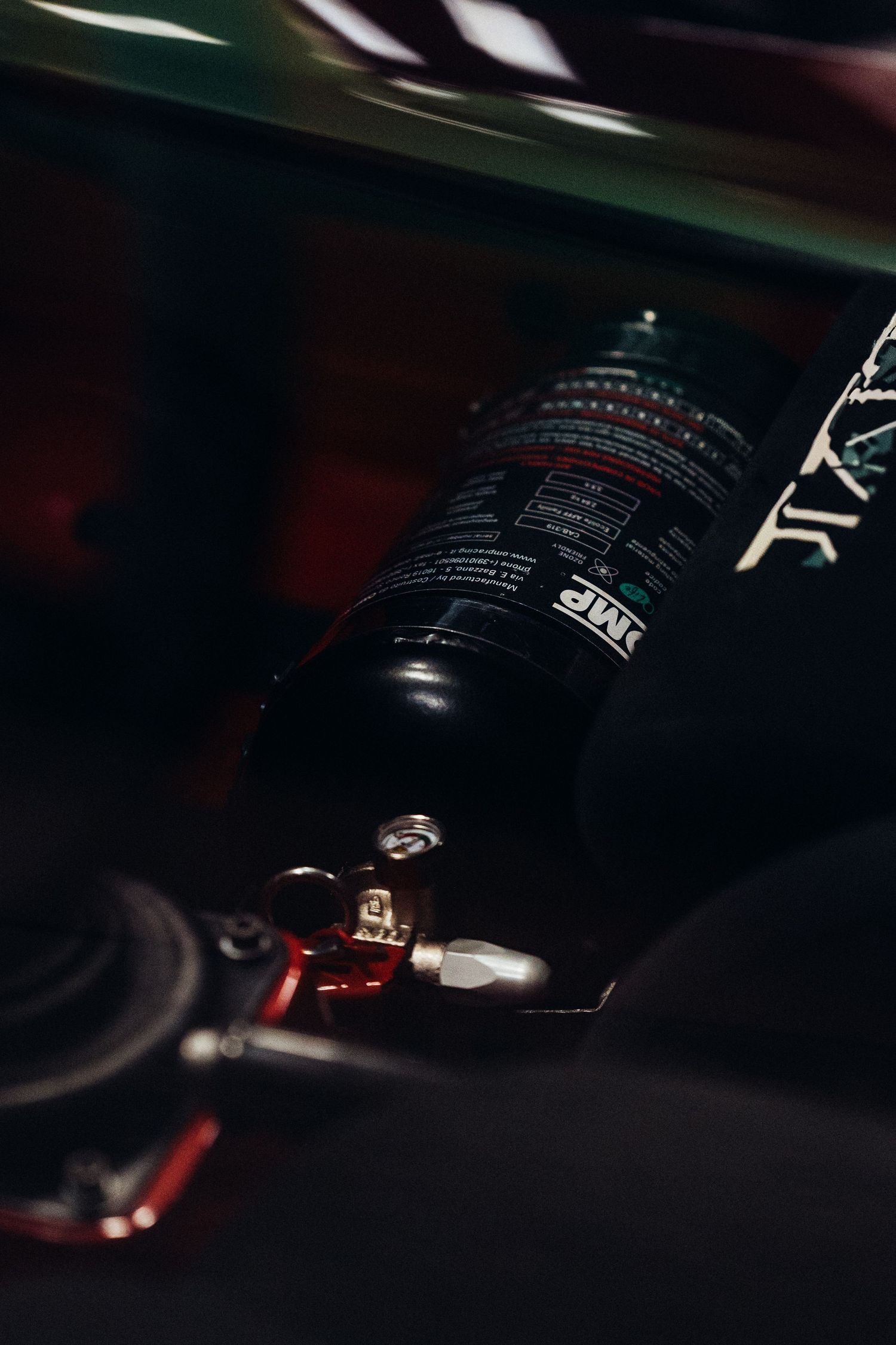 Artistic close-up of racing equipment and gear in dramatic lighting.