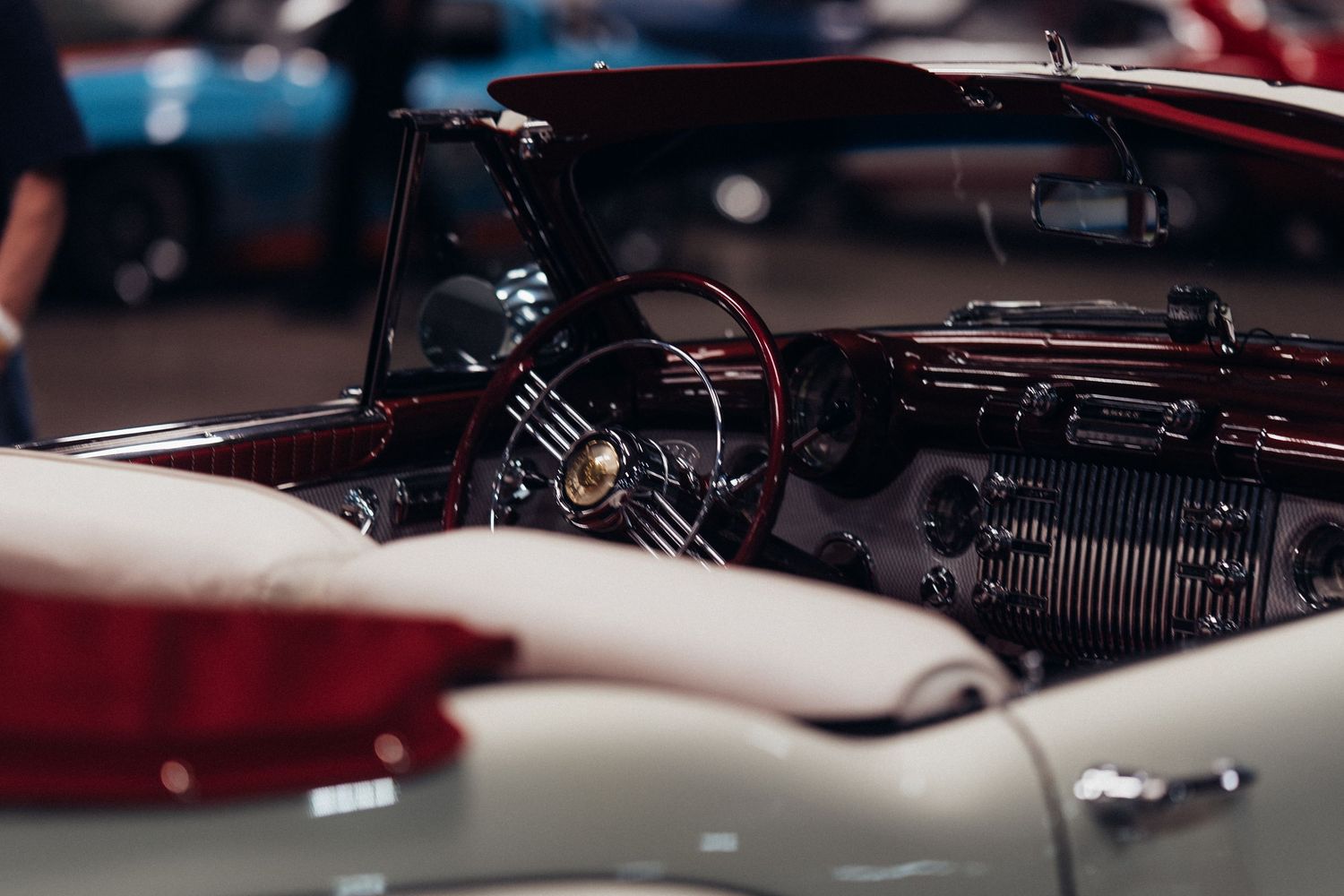 Detail shots of vintage car engines and mechanical components in dramatic lighting.