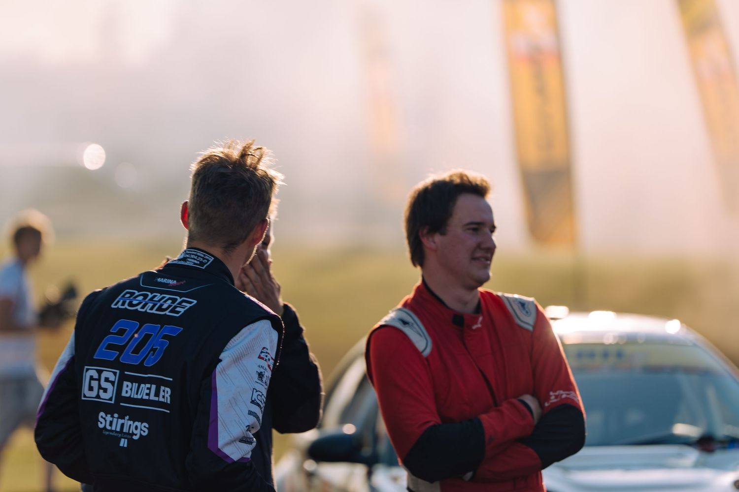 Group of RS Gold crew members stand at attention before training at an outdoor facility at sunset.