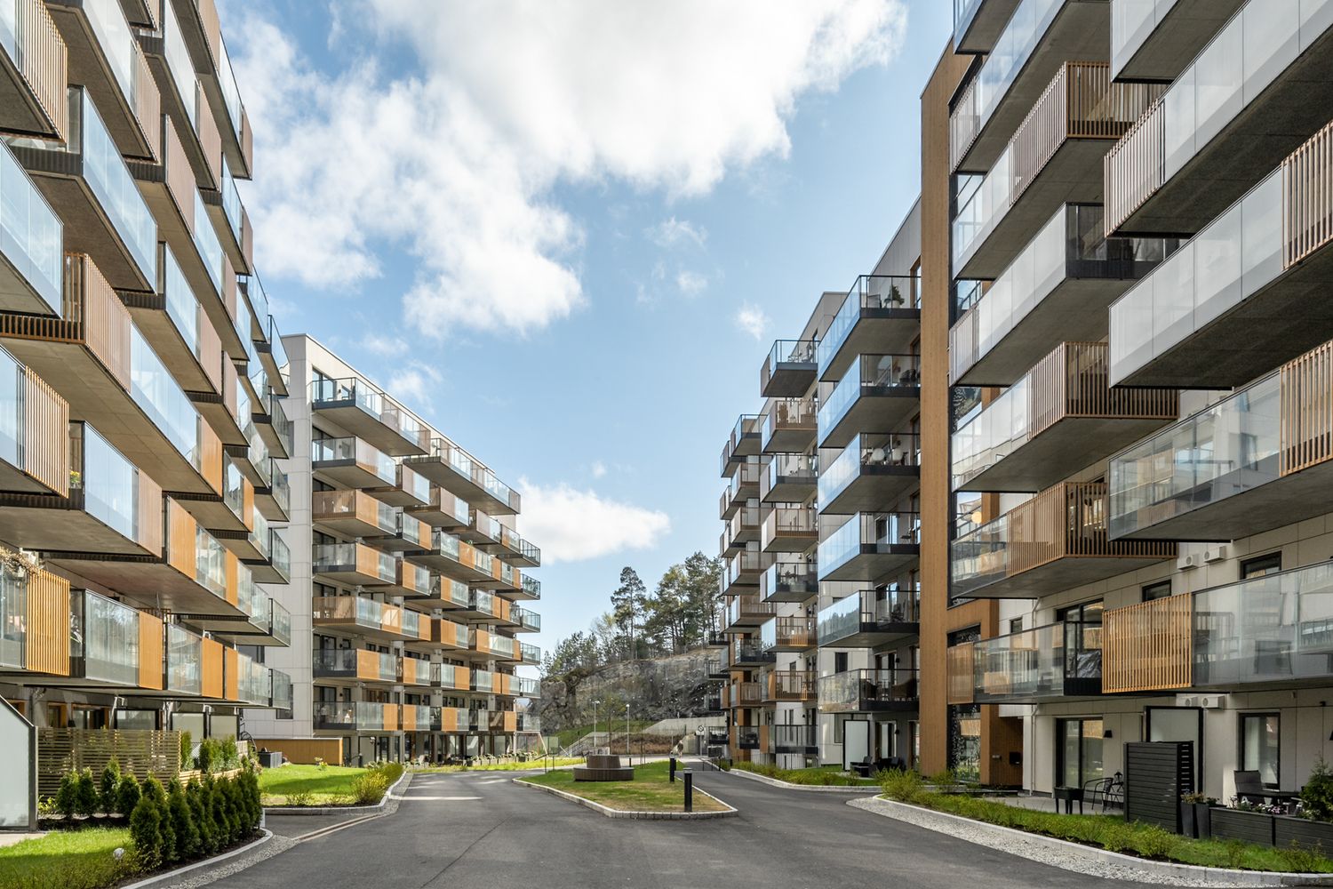 Contemporary apartment development with winding pathways and landscaped grounds.