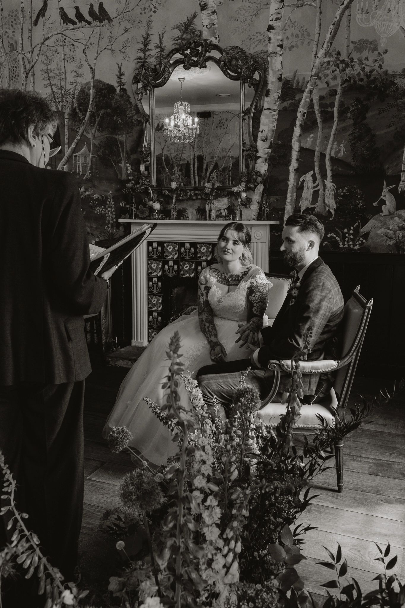 A black and white montage of wedding photos showing an outdoor garden ceremony with floral decorations.