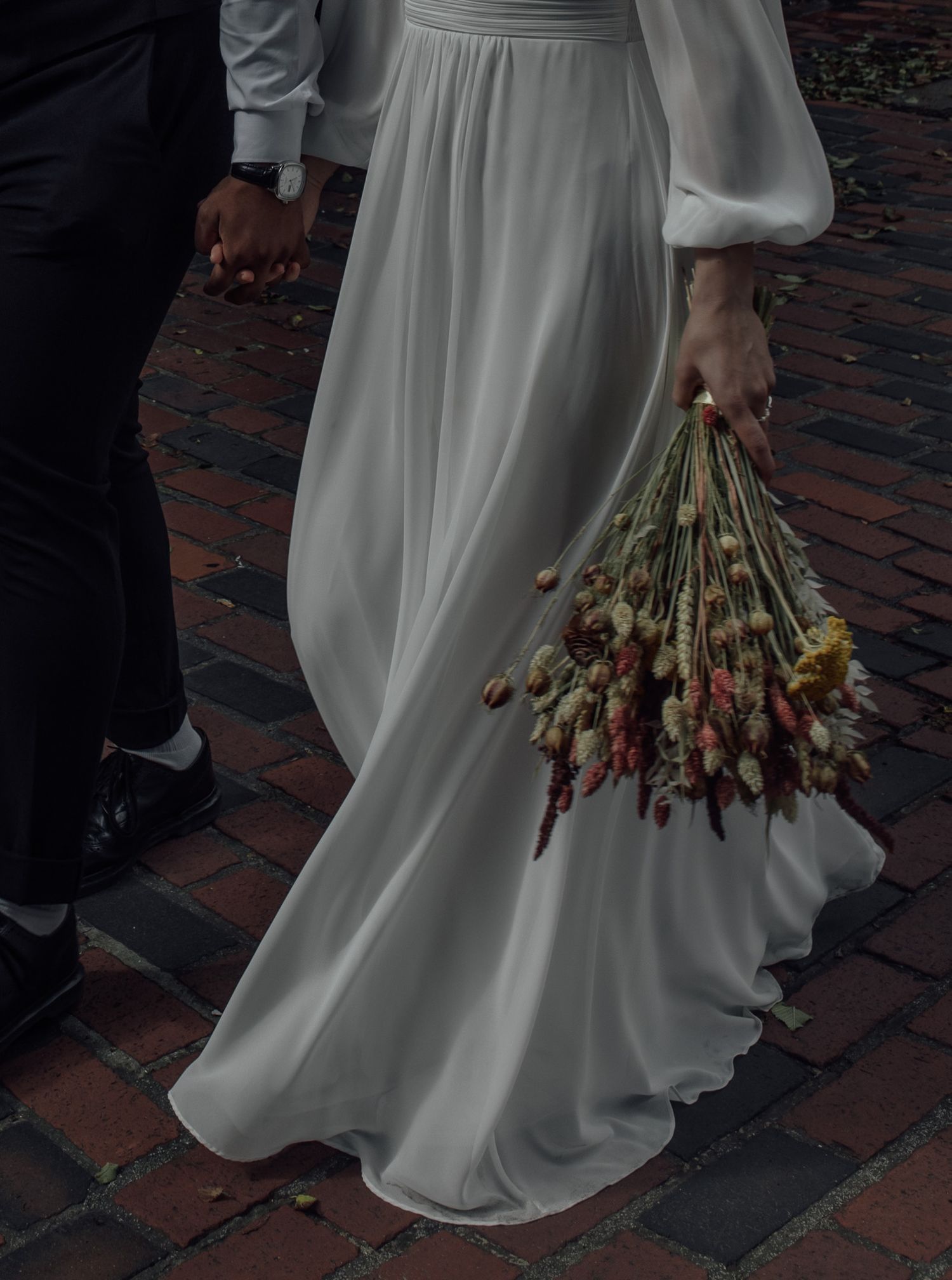 A sequence of photos showing a flowing white wedding dress and bouquet against a brick walkway.