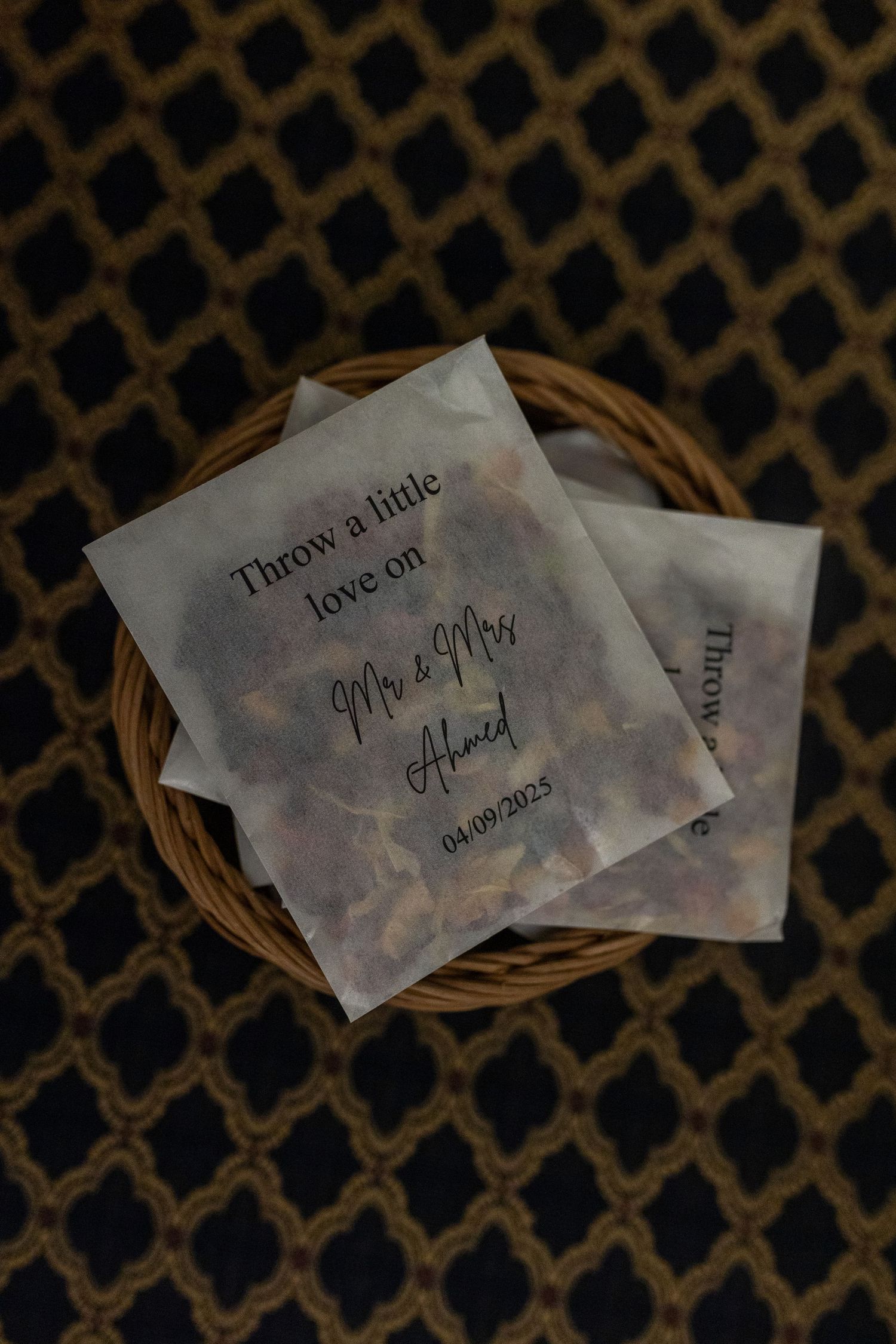 A series of small handwritten notes arranged in a row against a dark patterned background.