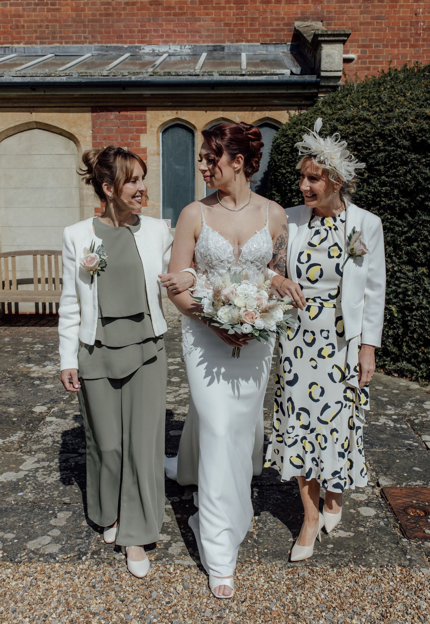 Bride walks with mother figures after ceremony