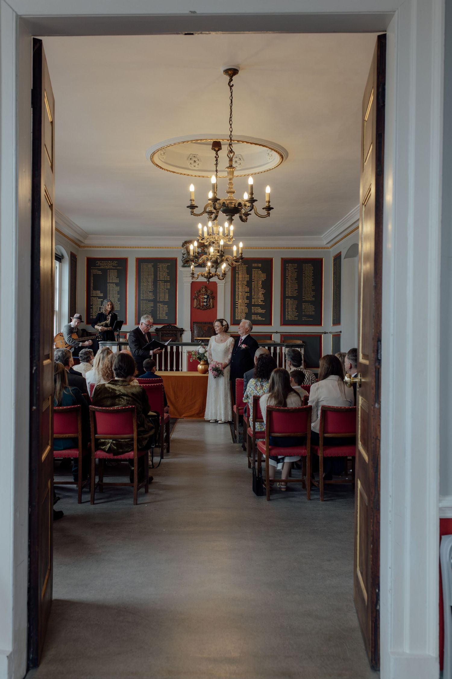 Looking in at a wedding ceremony taking place.