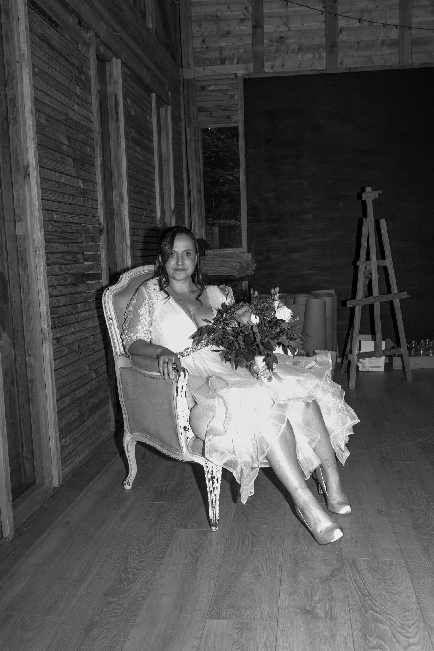 A black and white photo sequence shows someone falling sideways off a chair on a wooden porch.