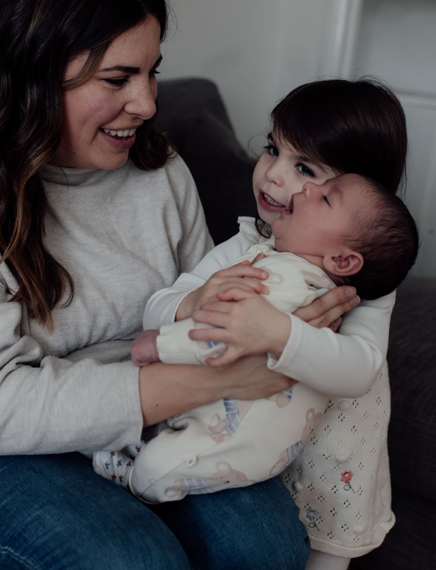 A series of candid photos showing a parent and children sharing joyful moments together in casual indoor settings.