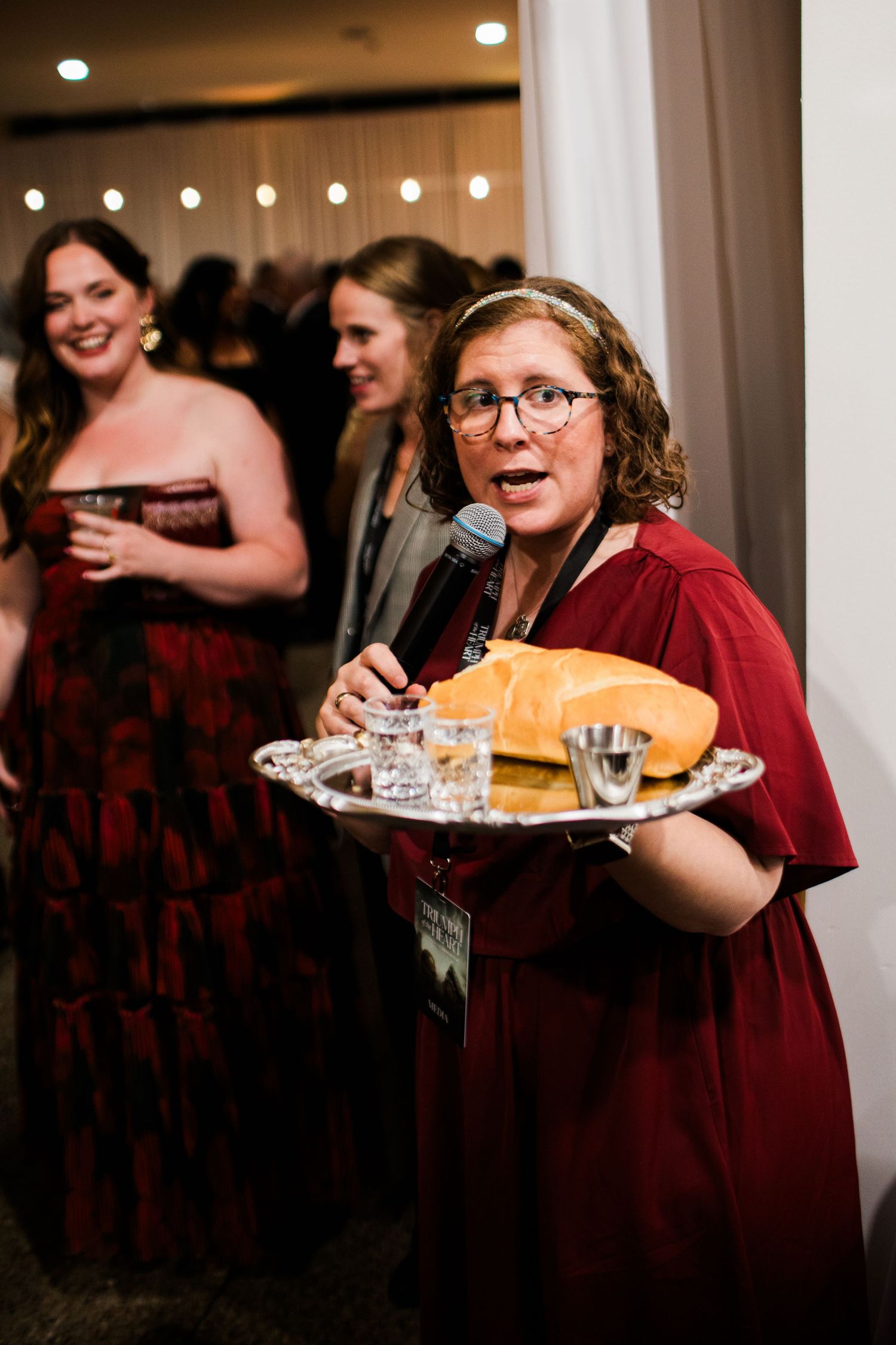 A series of four candid reception photos showing someone in burgundy giving a speech at a wedding celebration.